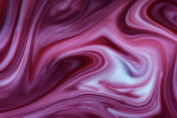 An abstract image of a creamy, fluid, swirling, satin-like appearance surface created from milk and red and blue food colouring 