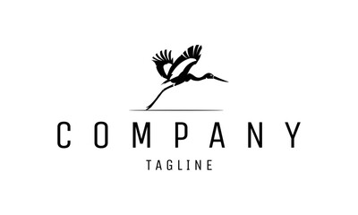 Fototapeta premium Illustration silhouette flying stork bird logo design vector