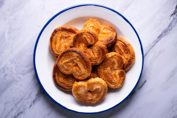 Palmeritas. Puff pastry palm trees with sugar. Spanish traditional dessert.