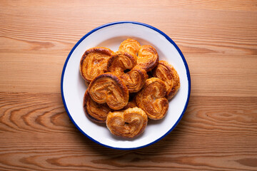Palmeritas. Puff pastry palm trees with sugar. Spanish traditional dessert.