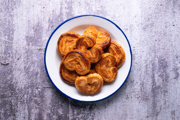 Palmeritas. Puff pastry palm trees with sugar. Spanish traditional dessert.