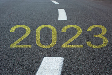 New start of the new year 2023. Starting to new year. 2023 written on the road 