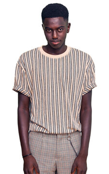 Young african american man wearing casual clothes praying with hands together asking for forgiveness smiling confident.