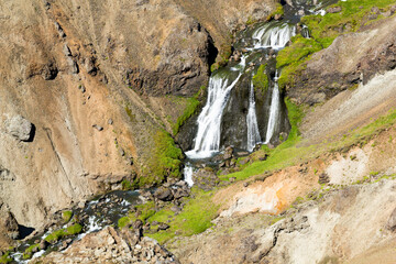 view from above to the waterfall Djúpagilsfoss the valley of  Reykjadalur, Iceland