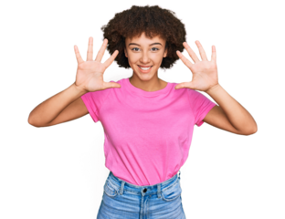Young hispanic girl wearing casual clothes showing and pointing up with fingers number ten while smiling confident and happy.