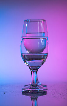 Wine glasses with neon multicolor light