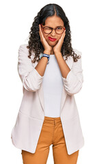 Young african american girl wearing business clothes covering ears with fingers with annoyed expression for the noise of loud music. deaf concept.