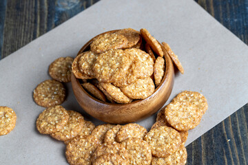 oatmeal thin round cookies with lots of sesame seeds