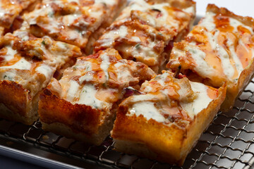 detroit pizza on an iron tray