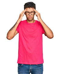 Young handsome african american man wearing casual clothes suffering from headache desperate and stressed because pain and migraine. hands on head.