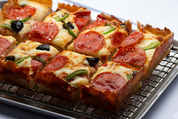 detroit pizza on an iron tray
