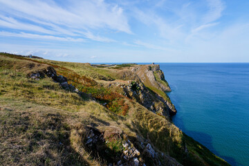 Fototapeta na wymiar Tall, steep limestone cliffs at Rhossili Bay