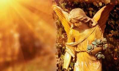 Beautiful guardian angel. Fragment of an antique statue. Free copy space for design or text.