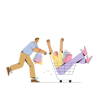 Young Man Pushing Supermarket Trolley With Shopping And Woman Sitting In It.