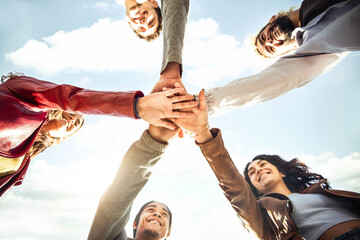 Multiracial happy young people stacking hands outside - Diverse friends unity togetherness in...