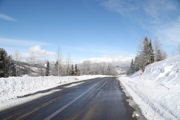 Fototapeta na wymiar scenic view of empty road with snow covered landscape while snowing in winter season.turkey