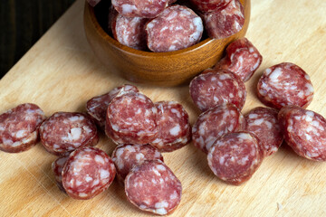 Cut the finished sausage into pieces on a cutting board