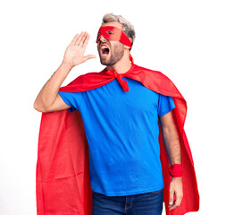 Young blond man wearing super hero custome shouting and screaming loud to side with hand on mouth....