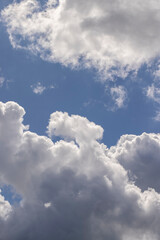 Clouds floating across the sky in the daytime