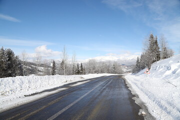 Fototapeta na wymiar scenic view of empty road with snow covered landscape while snowing in winter season.turkey