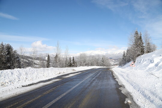 scenic view of empty road with snow covered landscape while snowing in winter season.turkey