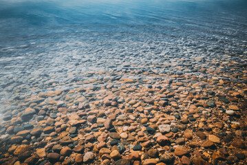 Stones in clear water on the seashore