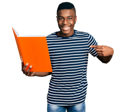 Young african american man holding book pointing finger to one self smiling happy and proud