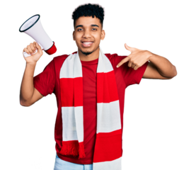 Young african american man football hooligan holding megaphone pointing finger to one self smiling happy and proud