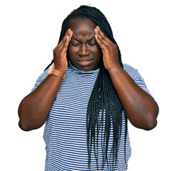 Young black woman with braids wearing casual clothes with hand on head for pain in head because...