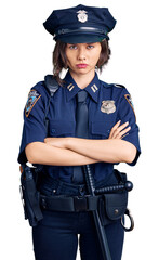 Young beautiful girl wearing police uniform skeptic and nervous, disapproving expression on face...