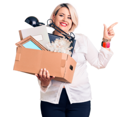 Young blonde plus size woman fired holding box smiling happy pointing with hand and finger to the side