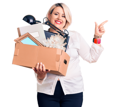 Young blonde plus size woman fired holding box smiling happy pointing with hand and finger to the side