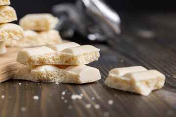 a white chocolate bar broken into pieces