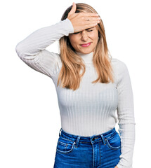 Fototapeta premium Young blonde woman wearing casual clothes surprised with hand on head for mistake, remember error. forgot, bad memory concept.