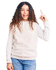Beautiful kid girl with curly hair wearing casual clothes pointing finger up with successful idea....