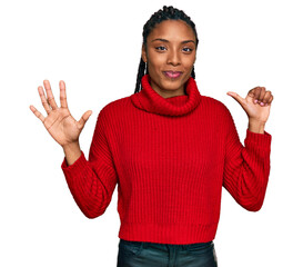 African american woman wearing casual winter sweater showing and pointing up with fingers number six while smiling confident and happy.
