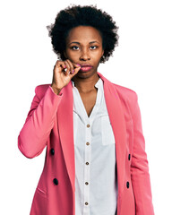 African american woman with afro hair wearing business jacket mouth and lips shut as zip with...