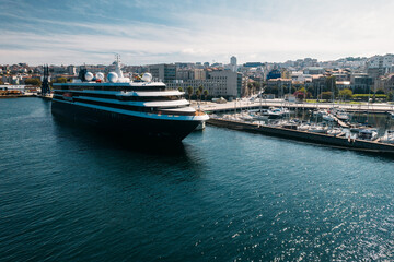Aerial drone view of cruise ship, marina and view of centre of Vigo, Galicia, Spain