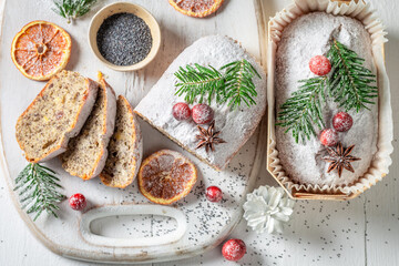 Obraz na płótnie Canvas Poppy seed cake for Christmas with cranberry and dried orange