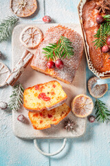 Obraz na płótnie Canvas Delicious and homemade Fruitcake for Christmas with orange and cranberry