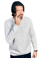 Middle age caucasian man wearing casual clothes pointing to the eye watching you gesture, suspicious expression