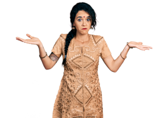 Young indian woman wearing traditional dress clueless and confused with open arms, no idea and doubtful face.