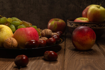 Beautiful still life of fruits on a wooden table. Decor.