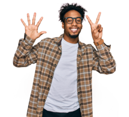 Young african american man with beard wearing casual clothes and glasses showing and pointing up with fingers number seven while smiling confident and happy.