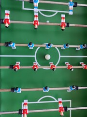 Arcade table soccer with tools for playing for office and home games.