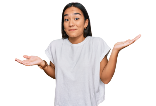 Young asian woman wearing casual white t shirt clueless and confused expression with arms and hands raised. doubt concept.