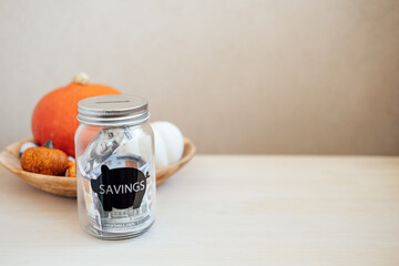Save Money Thanksgiving day ideas, Savings, Thanksgiving on Budget. Glass mason jar piggy bank with...