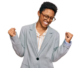 Young african american woman wearing business clothes very happy and excited doing winner gesture with arms raised, smiling and screaming for success. celebration concept.