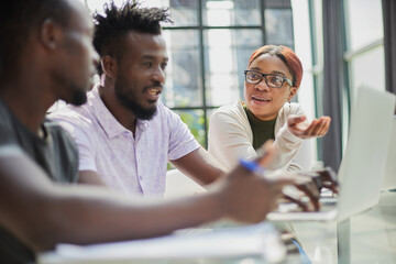 Successful african american business team talking about strategy at office