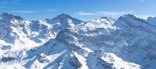 Fototapeta na wymiar The Panoramic of Swiss Mountain against the blue sky background